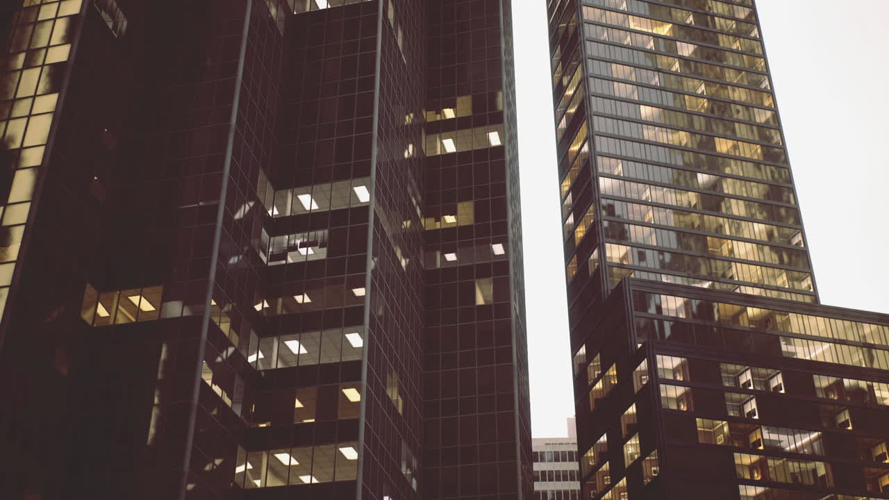 Modern skyscrapers reflect golden sunlight in a vibrant urban setting