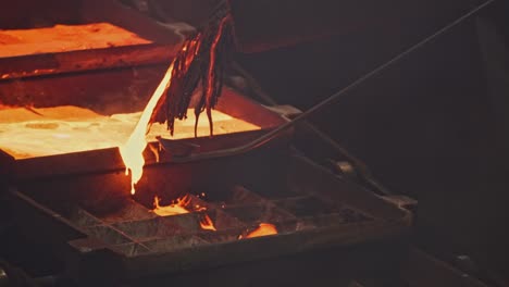 molten metal pouring into casting molds