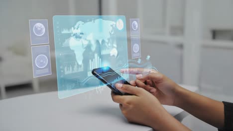 person interacting with a holographic data display and smartphone