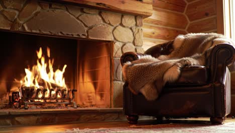 cozy comfort by the hearth: a plush armchair accented with soft fur throws and a warm crackling fire in a rustic log cabin setting