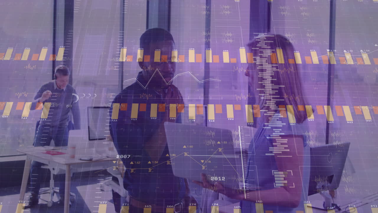 In modern office, business professionals discussing data with financial graphs overlay