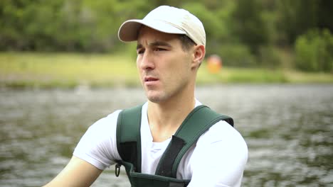 shot of a caucasian male fisherman casting his hook while fly fishing-3