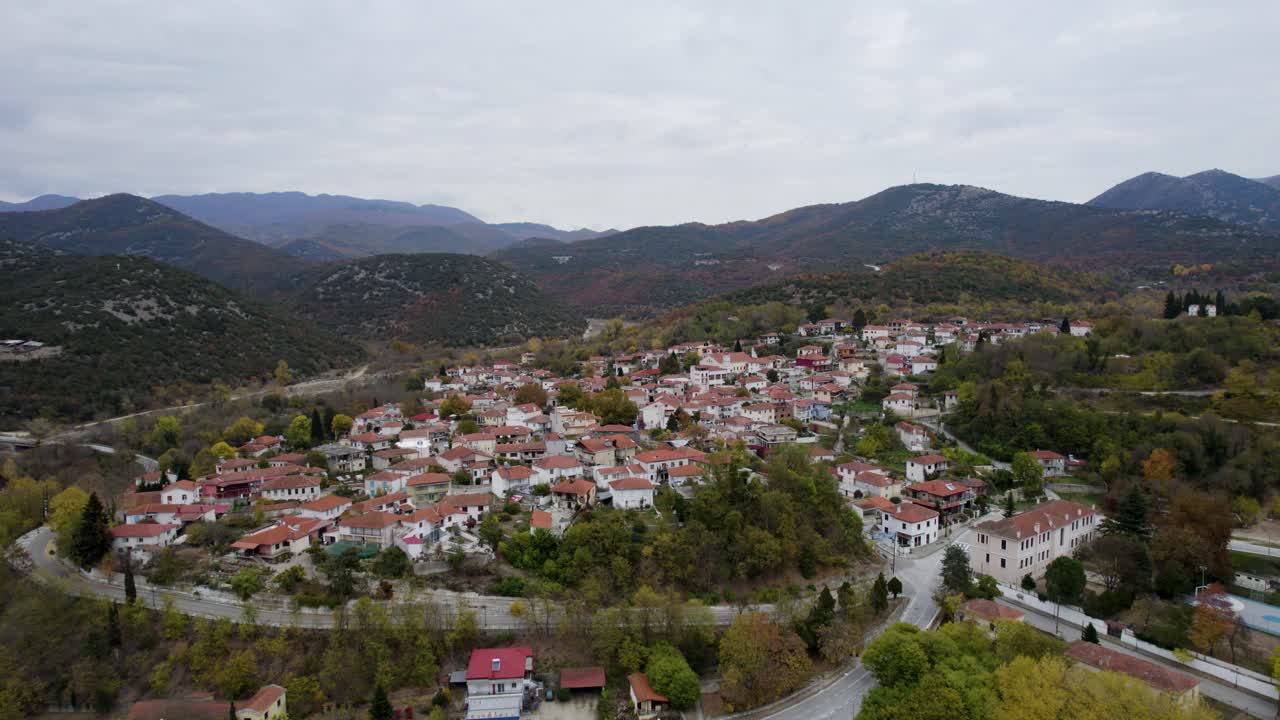Stavroupoli Xanthi Greece, Aerial Pullback Shot, Panoramic View of Traditional Houses and Nearby Forest