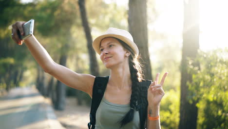 woman taking selfie in a forest