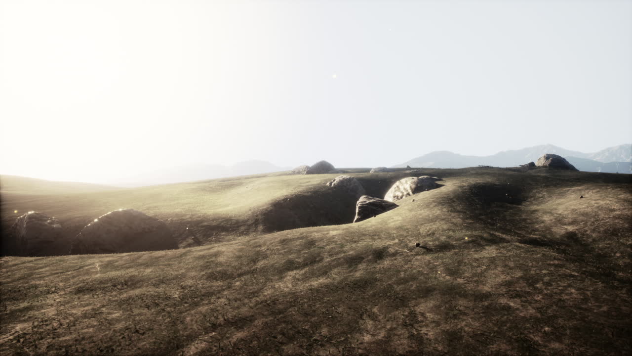 Sunlit serene landscape with rolling hills and rocky outcrops