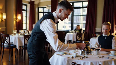 waiter serving in a classy restaurant