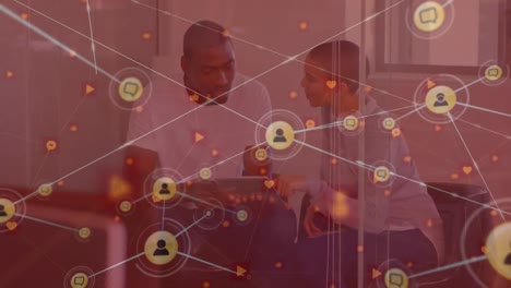 Animation-of-network-of-connections-over-diverse-business-people-using-tablet