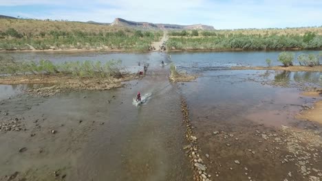 Drone-motorbikes-ride-through-water