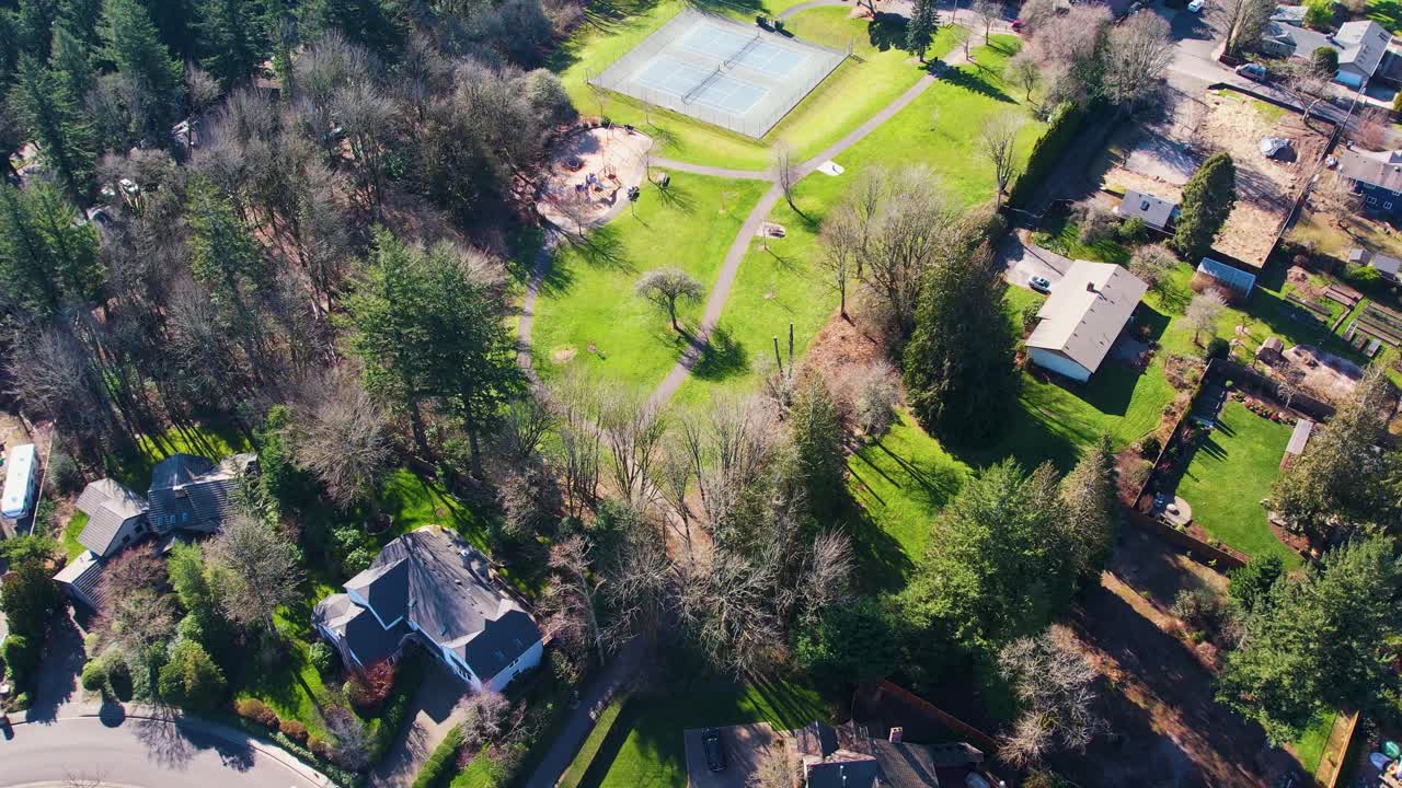 4K aerial drone shot overlooking local public park in Portland, Oregon