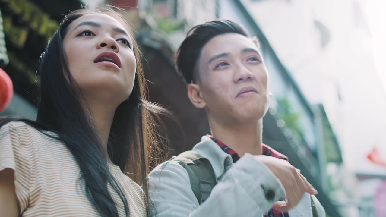 Handheld view of  Vietnamese tourists choosing the best path