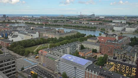 aerial view of an intersection and the city of copenhagen on a sunny summer day