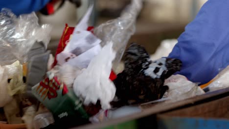 plastic rubbish on a conveyor belt being sorted for recycling