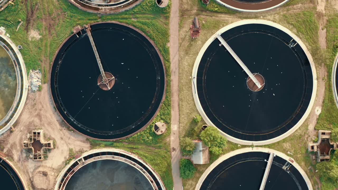 Aerial top view of round polls in wastewater treatment plant, drone shot