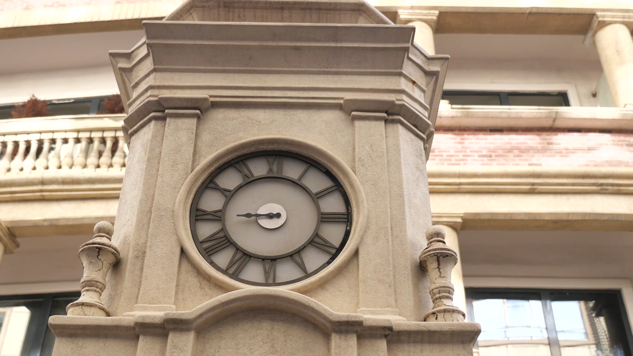 Ornate Clock Tower with Roman Numerals and Moving Hands