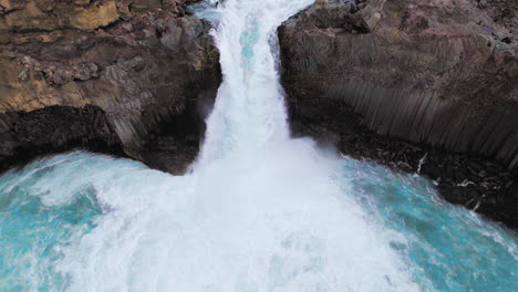 drone aerial view of the aldeyjarfoss waterfall in north iceland.