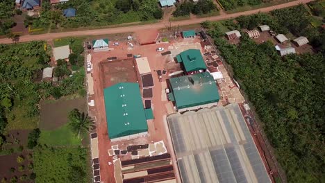 coffee production in uganda, aerial scene of factory and sun drying coffee beans after harvest