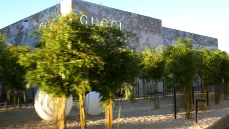 gucci store exterior with landscaping