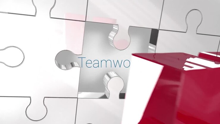 Key unlocking red piece of puzzle showing teamwork