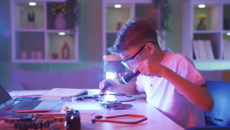 the boy who damaged the computer part. smoke comes out of the electronic board.