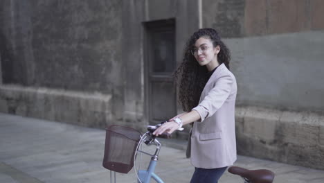 young woman on a bicycle in the city