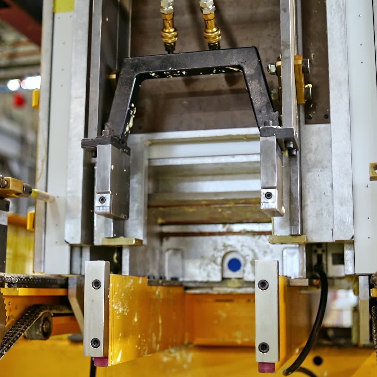 Robotic equipment at work. Modern factory indoors. Upgraded technology inside the plant. Close-up industrial process.