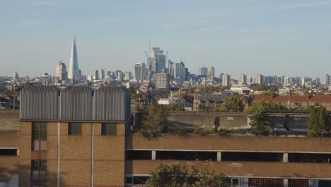 view of office buildings and skyline of city of london from peckham in south london uk