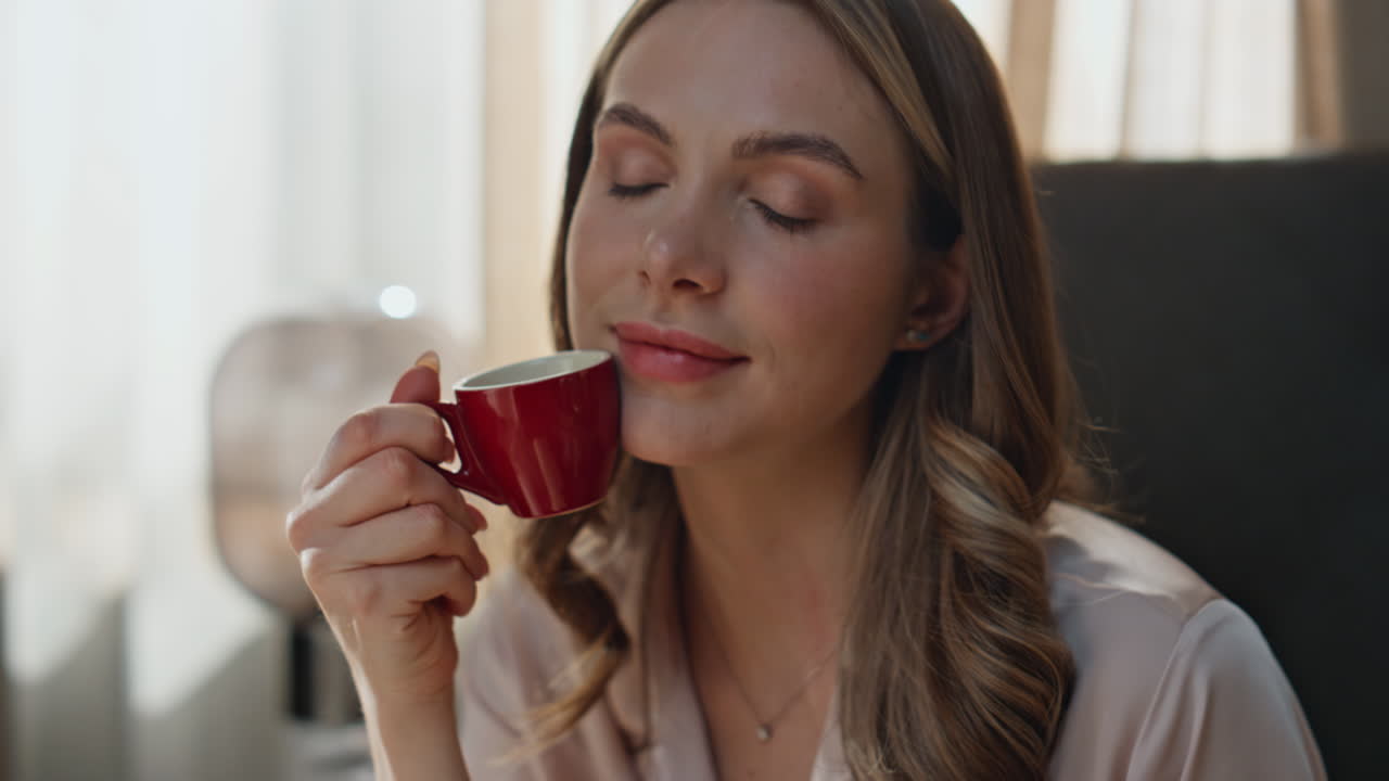 Woman enjoying coffee and reading a book
