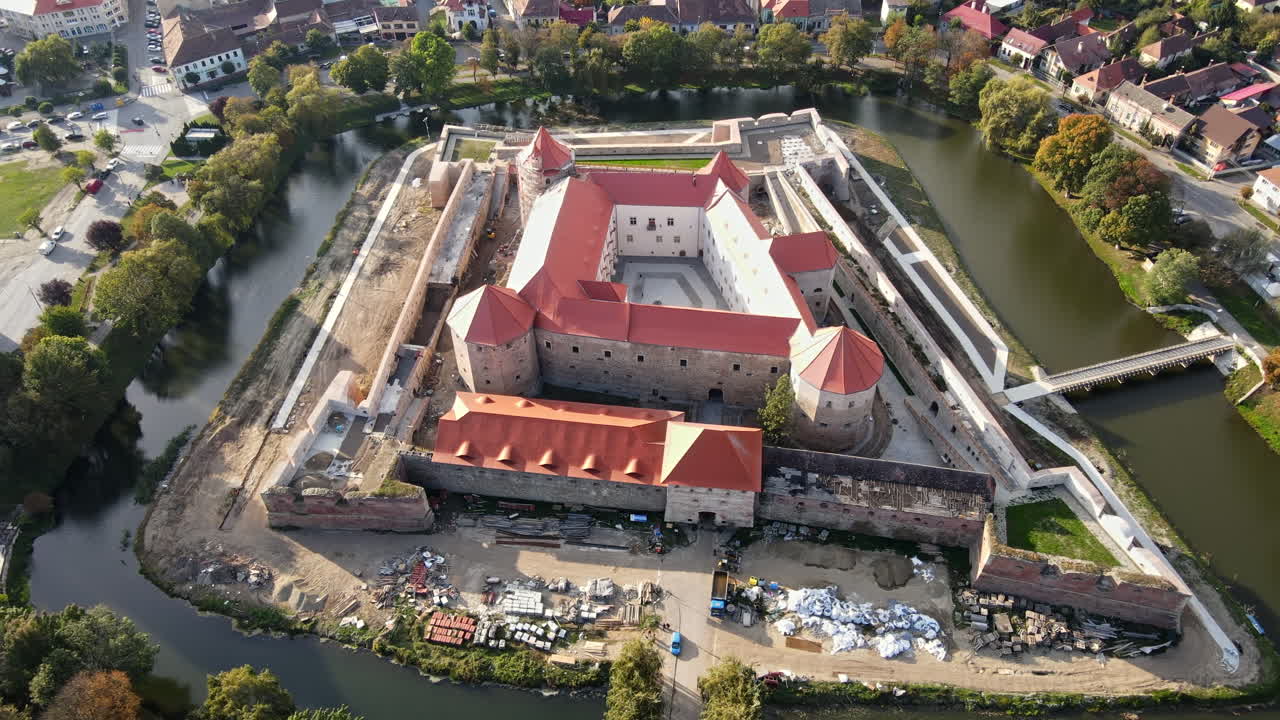 Aerial drone view of the Fagaras, Romania. Fagaras Citadel surrounded by a moat, buildings, roads, greenery