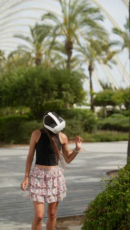 woman experiencing virtual reality in a park