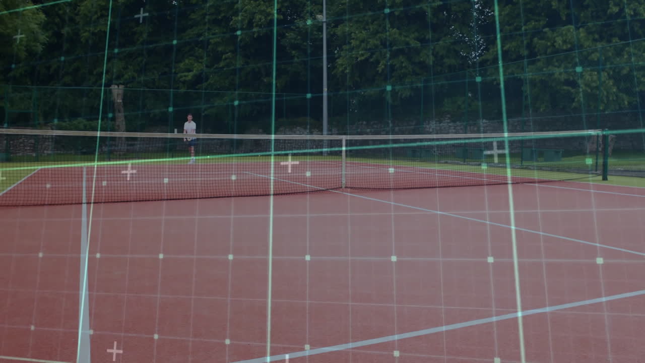 Man standing behind tennis net on red clay court, showcasing sports technology grid overlay