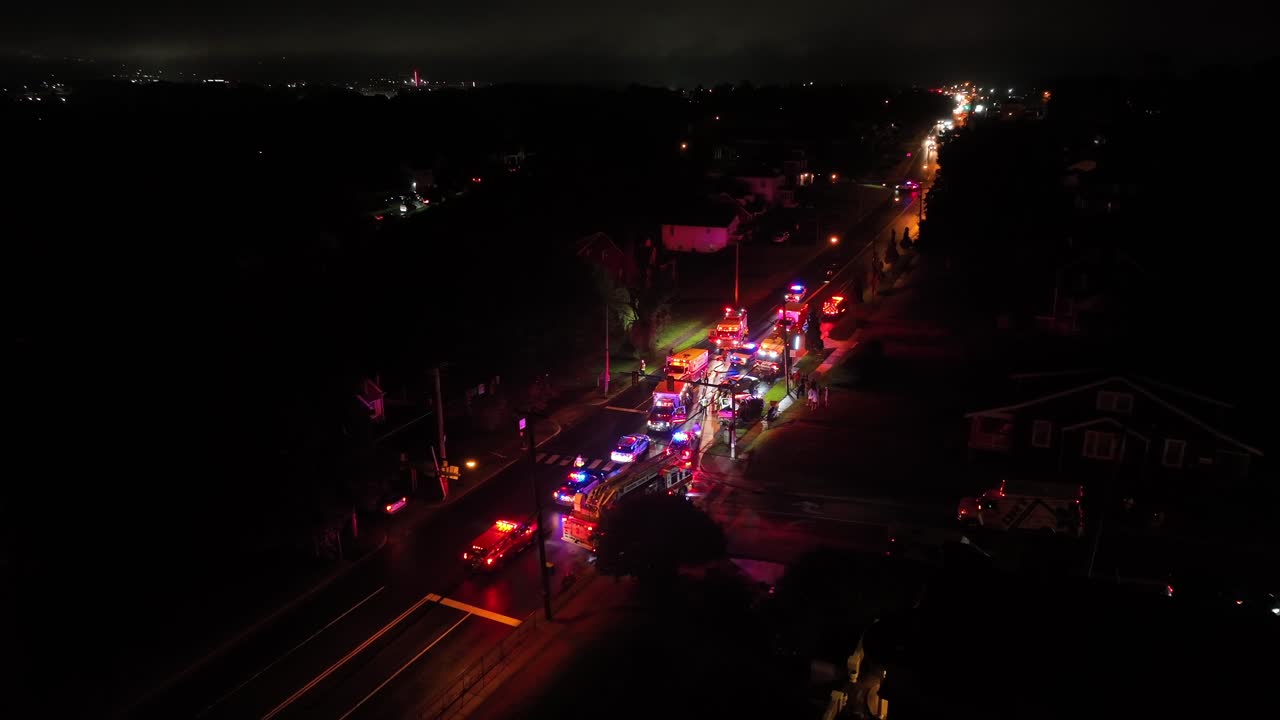 Aerial View of Emergency Vehicles Responding to an Incident at Night