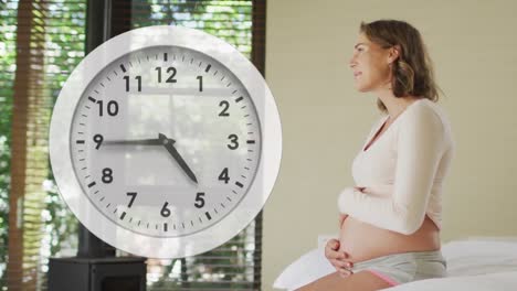 fast moving clock over happy pregnant caucasian woman smiling and holding belly