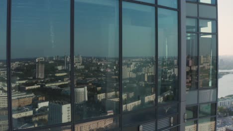 city skyline reflected in skyscraper windows