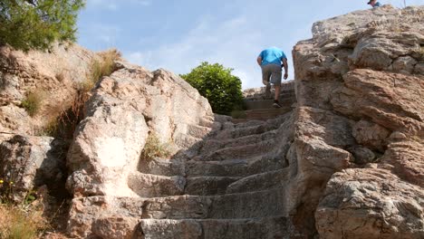 tourist climbing steps in athens