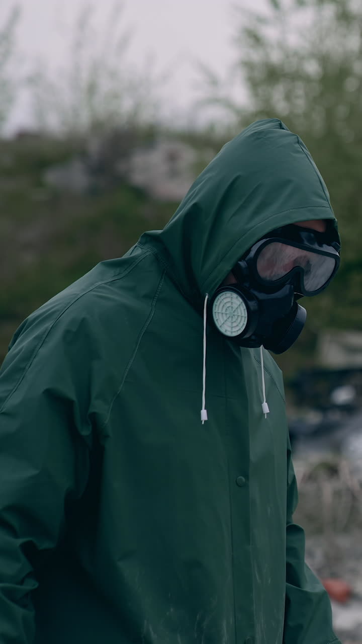 Man wearing gas protection suit. Industrial radiation environment pollution