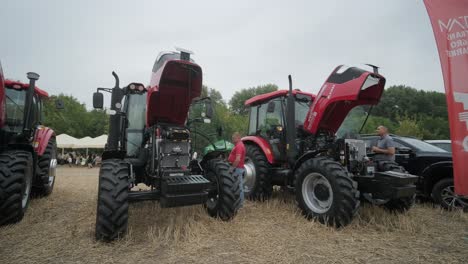 demonstration of agricultural machinery at an exhibition. tractors operate in the field, showcasing their capabilities and performance in action