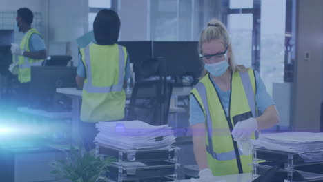 cleaning office space, workers in safety vests and masks with blue light animation
