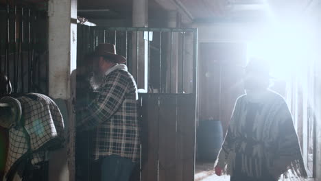 couple inside the stables