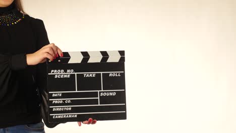 woman holding clapperboard