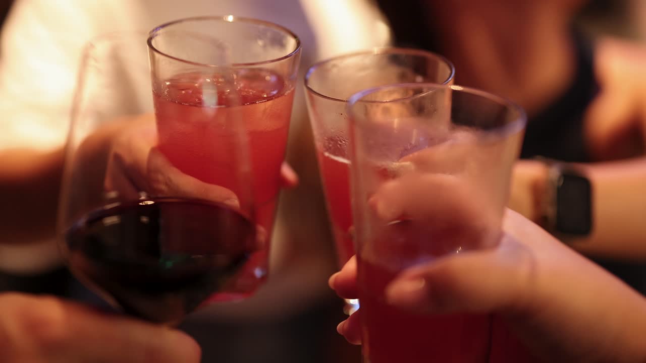 Friends toasting with drinks at a celebration