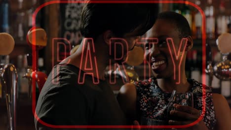 Animation-of-neon-party-text-in-red-frame-over-biracial-couple-chatting-in-bar