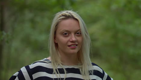 Blonde-girl-in-zebra-shirt-smiling-and-looking-straight-into-the-camera