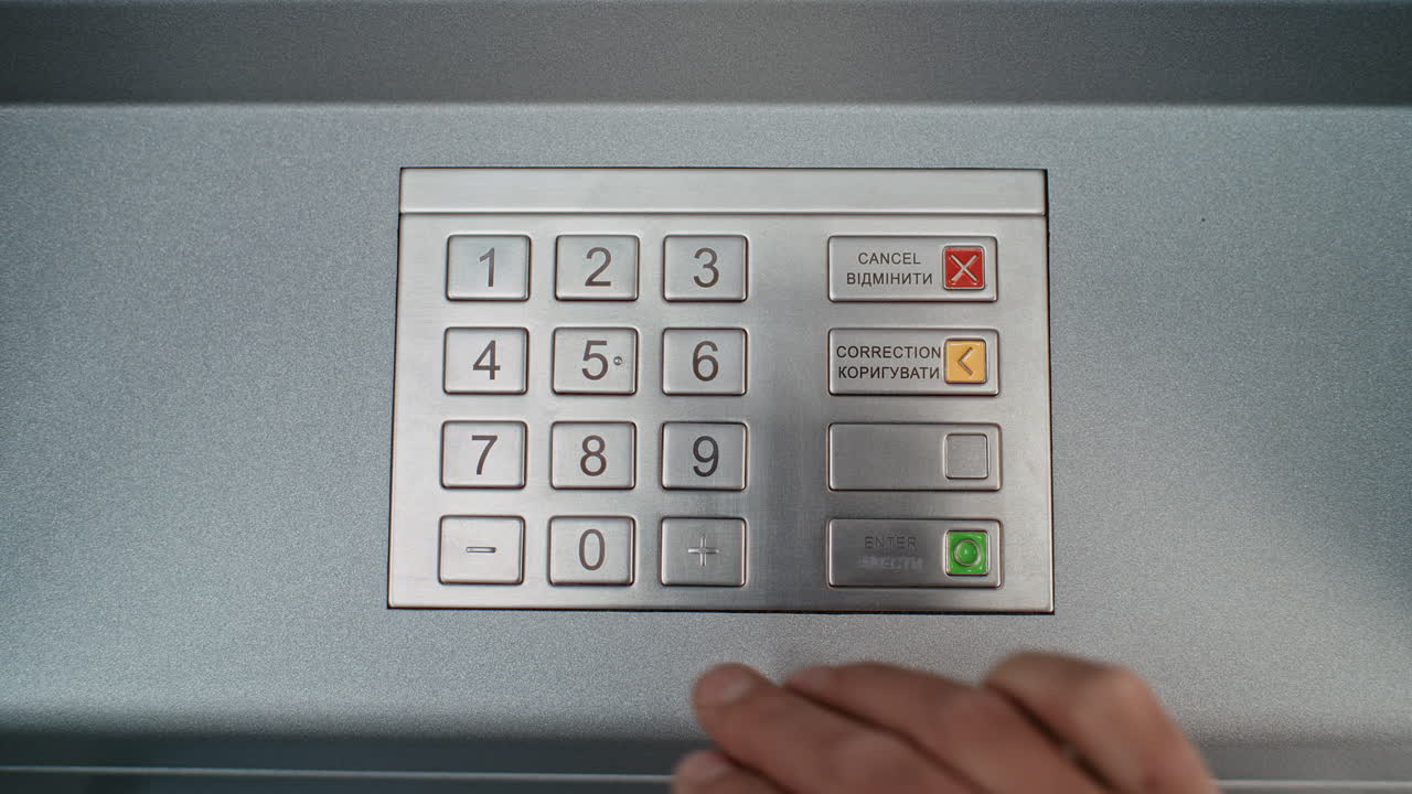 Person Entering PIN into ATM