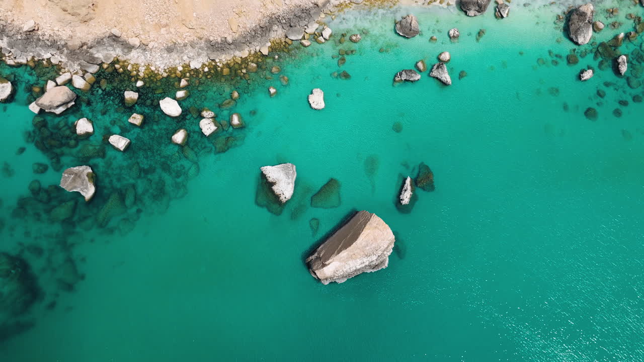 Aerial View of Turquoise Ocean with Rocks
