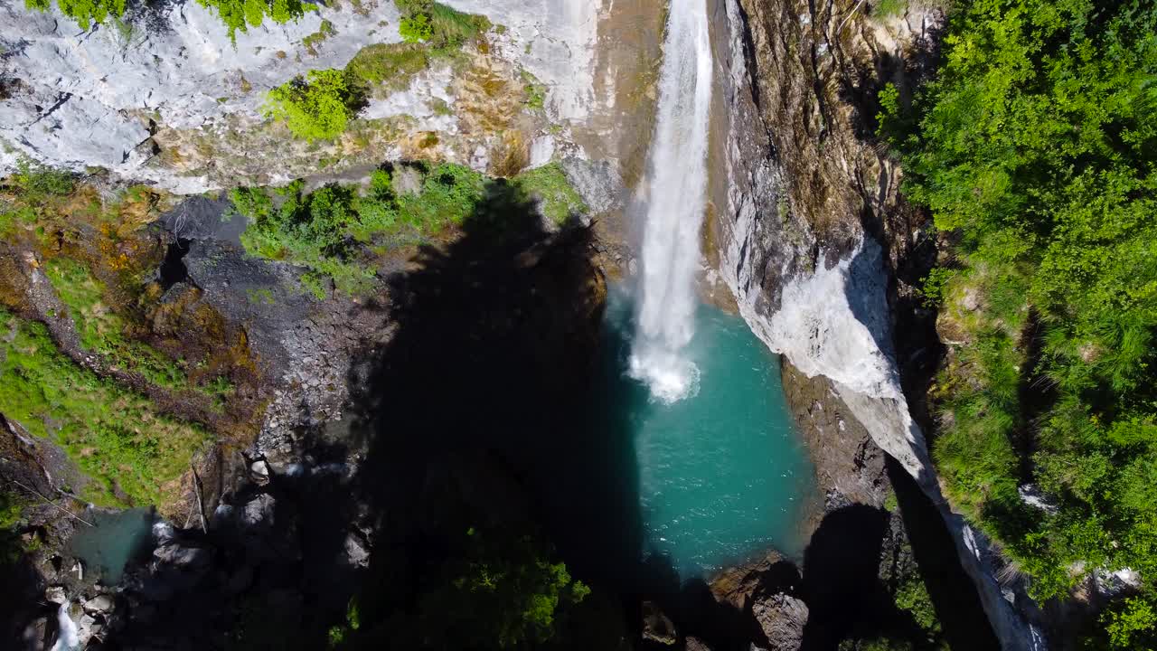 Breathtaking Aerial Shot of Berglist&uuml;ber Waterfall in Switzerland