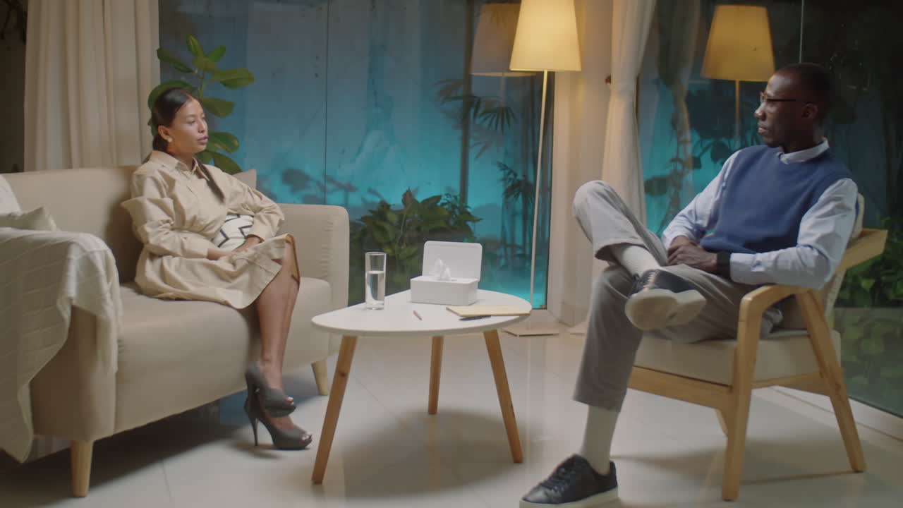 Asian Woman Shaking Hands and Speaking with Psychologist