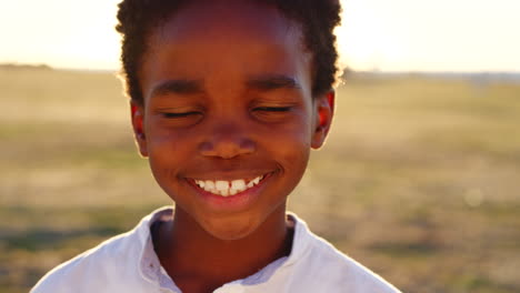 Black-child,-boy-and-face-at-sunset-in-nature