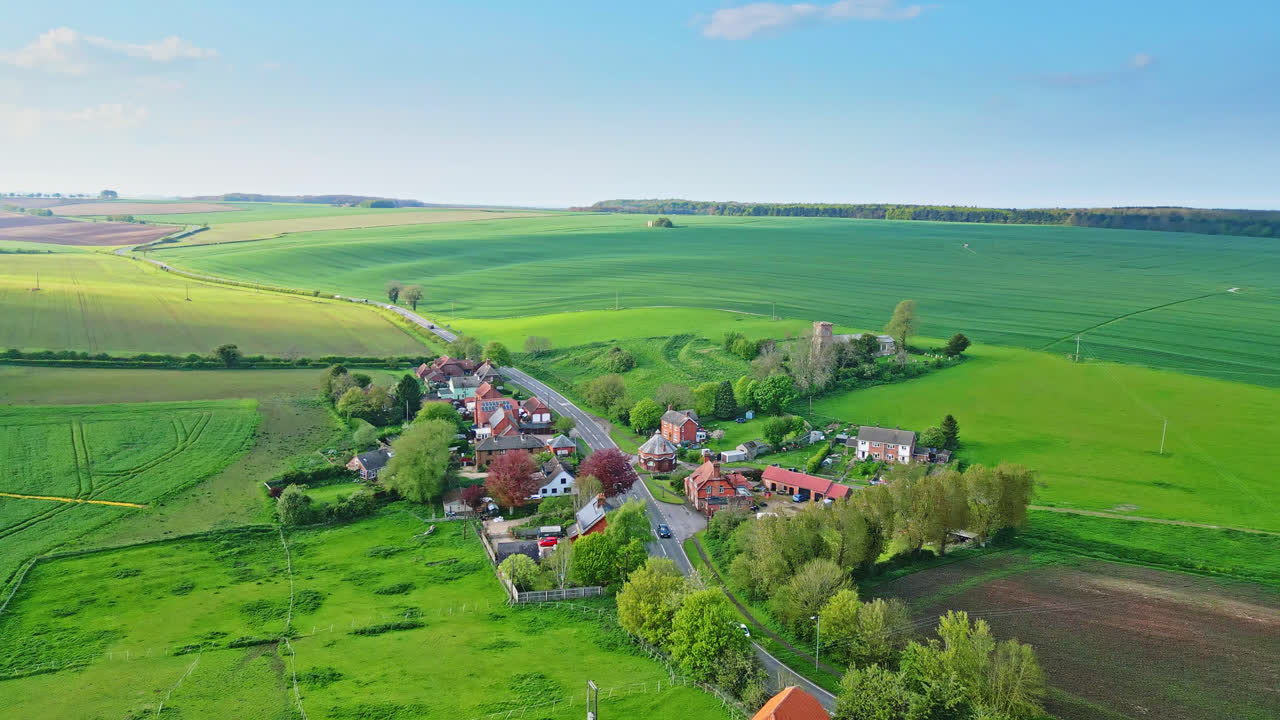 Drone imagery exhibits Burwell village, former medieval market town&mdash;surrounded by country fields, classic red brick homes, and the abandoned Saint Michael parish church on Lincolnshire's Wold Hills