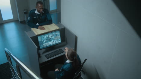 security guards monitoring surveillance system