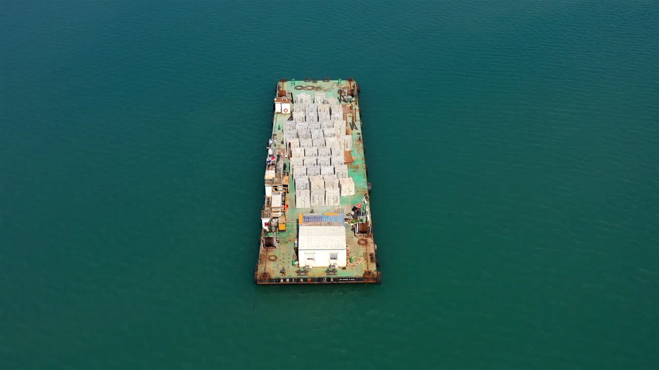 Barge carrying concrete blocks